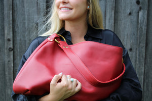 The Kerry Noël Genuine Leather Hobo Handbag is soft and durable enough to carry every day! This brightly colored red hobo is available on kerrynoel.com
